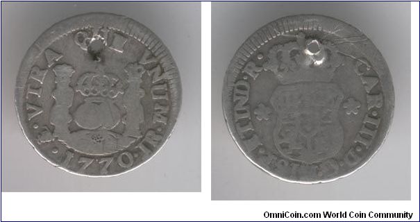 Spanish Milled 1/2 Reale, raw, holed. Interesting little coin.