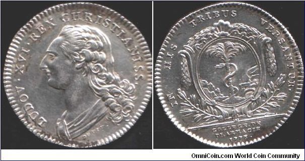 Another very rare silver jeton, this time of the College of Pharmacy in Paris.Coin rotation. Obverse young bust of Louis XVI by DuVivier. Reverse arms of the ancient guild of epiciers and apothiquaires.