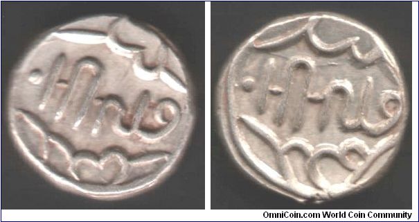 Silver rupee from the Indian State of Banswara. Apparently the legends are a secret script invented by the ruler `Lakshman Singh' himself. Nothing like a good mystery to keep the plebs amused.