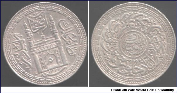 Silver rupee from the Indian State of Hyderabad minted under Mir Mahbub Ali Khan II. First type with palace obverse.