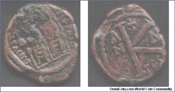Copper 20 nummi of Justin II (565 -578 AD) and Sophia of the Byzantine Empire. This coin struck in year 4 (569 AD) and at the Thessalonica mint in Greece. Copper `rot' has got the better of the king and queens heads otherwise coin is rather nice condition for type.