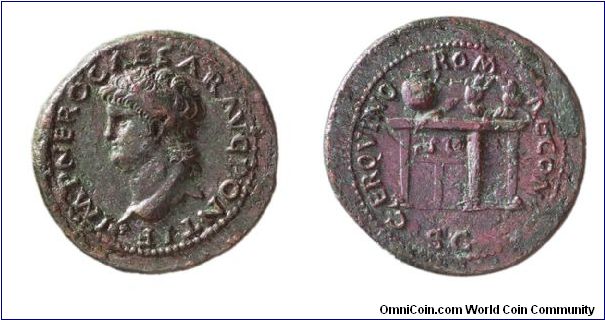 Orichaclum Semis issued for the quinquennial games.
Obv: Bust of Nero left, IMP NERO CAESAR AVG PONTIF.
Rev: Table with urn and wreath, CER QVINQ ROMAE CON, SC in exergue.