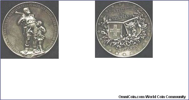 Large (50mm) shooting medal by Homberg minted in silver for the Cantonal shooting festival at Altdorf, Uri in 1890. Uri is the home of the William Tell legend.