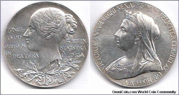 Large (56mm) silver medal commemorating Victoria's diamond jubilee. The yong head on the obverse is one of the best ever depictions of Queen Victoria (IMHO). Light marks and a few hairlines prevent me from saying that it's `unc'.