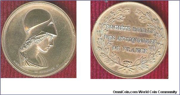 Gilt bronze medal of the Societe Royal des Antiquaires de France. Bust of Athena by Dubois and De Puymaurin. Not sure exactly when it was issued but the society was given its royal charter in 1814 (first restoration of the monarchy). The medal was probably issued to commemorate the event but possibly as late as 1817.
