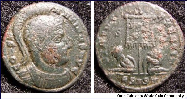 Constantine the Great 307-337
obv:Helmeted bust right curiassed
rev:two captives seated under banner
-corrosion-