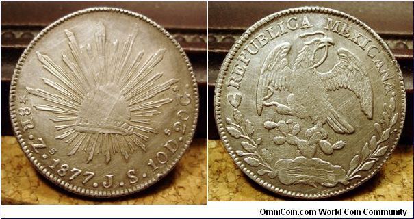 Mexican 8 reale.

Xf, weak strike with damaged obverse die or struck through something. 

Coin is surprisingly well struck elsewhere but the central elements are nearly obliterated.