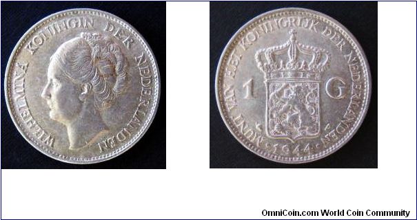 1944-P 1 gulden. This is the doorloper variety; the last two letters of Nederlanden run under Wilhelmina's neck.