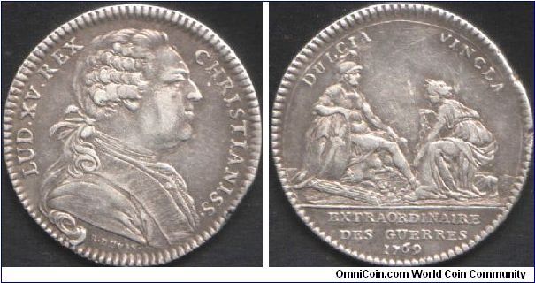 Silver jeton (engraved by benjamin Duvivier) issued for the `Extraordinaires des Guerres'. Obverse, a late bust of Louis XV. Reverse shows a soldier (representing French Military) with a chained female (allegorically as a `province' of France).