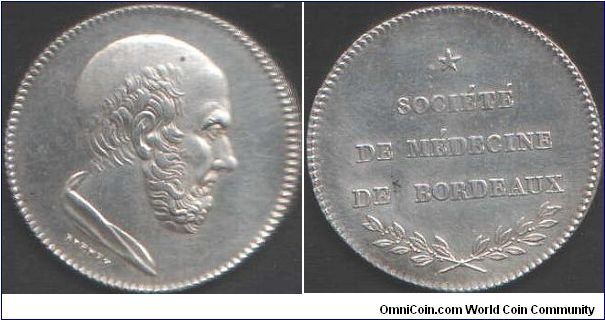 Silver jeton for the `Societe de Medecine de Bordeaux'. Obverse shows bust of Hippocrates by Brenet (circa 1830). This jeton has no edge markings signifying it was produced prior to 1832. These jetons were re-struck into the 1860's but the restrikes have appropriate edge markings.