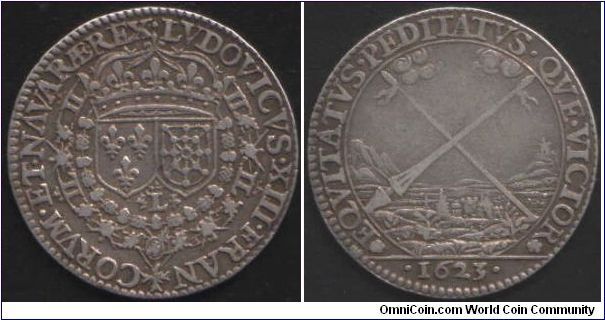 Silver jeton issued during the regency period of Louis XIII. I'm srtill in the dark as to which institution this jeton was issued for/by. Obverse arms of France and navarre. reverse pastoral scene with crossed lance and spear.
