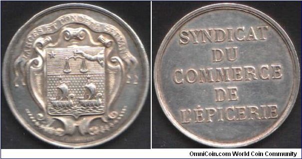 Silver jeton de presence issued to  members of the  Syndicat du Commerce de L'Epicerie. That is, the modern day equivalent of the Deuxieme Corps des Marchands de Paris (Grocers and Apothecaries guild).   Same coat of arms (two ships).