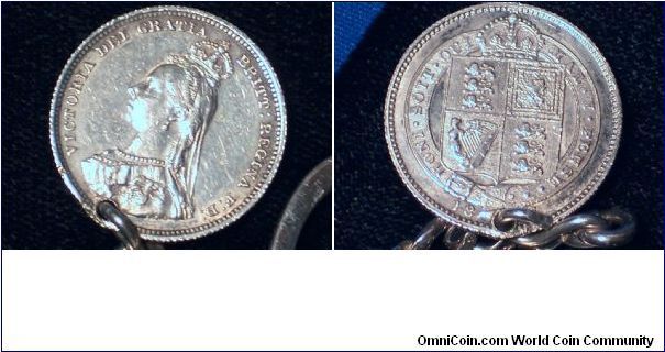 Pierced Jubilee Shilling used as keychain fob.  Looks like an AU, pierced right through the date.  It's attached to a nice, heavy sterling keychain.