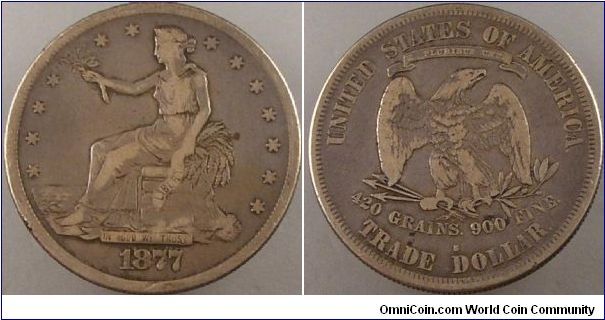 1877 s trade dollar
OBVERSE TYPE II, RIBBON ENDS POINT DOWN, 1876-1885

REVERSE TYPE II: NO BERRY BELOW CLAW, 1875-1885