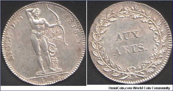 A silver jeton (original strike) issued for the Lycee des Arts, Paris during the revolution. Obverse, Apollo standing with bow. Reverse inscription `Aux Arts'.