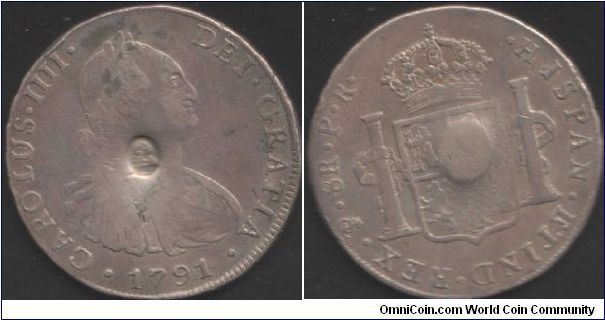 Bank of England oval countermarked dollar (issued in 1797) on a Potosi mint 8 reales dated 1791. The bank to make the money pass, placed the head of a fool on the neck of an ass.