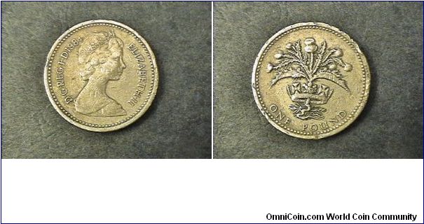 Elizabeth II DG REG FD, One Pound.

Edge: NEMO ME IMPUNE LACESSIT (No one provokes me with impunity) Scottish Design, some rim damage otherwish very fine condition.