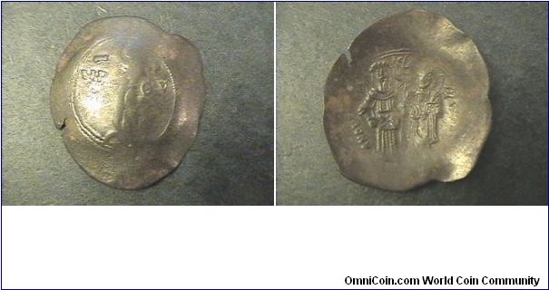 Byzantine Empire
Andronicus I 1183-1185
Billion Trachy
Obv: Virgin standing on dais nimbate head of infant christ facing left MP OV
Rev:ANDRONIKOS DESPOTHS, in greek lettering

Billon/19mm 2.2 grams, (cup coin)