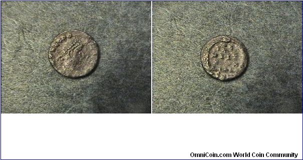 Theodosius II 402-450AD
Obv:DN THEODOSIVS PF AVG
Rev:VOTX MVLTXX
Young emperor.
AE/12mm 1.2 grams