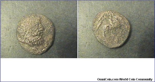 Unknown Greek,

Obv: Beaded head facing right.
Rev: person on horseback right.

AE/21mm 5.2 grams.

if anyone can id this coin please contact me.
