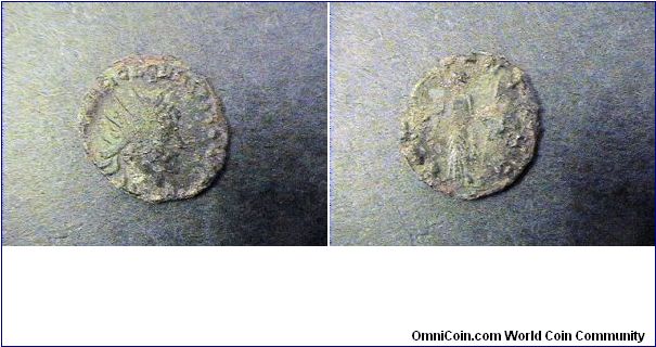 Quintillus 270AD
Obv:IMP CM AVR CL QVINTILLVS AVG
Obv:Providentia standing left holding wand over globe & scepter.
Siscia mint.
AE/18mm 2.3 grams