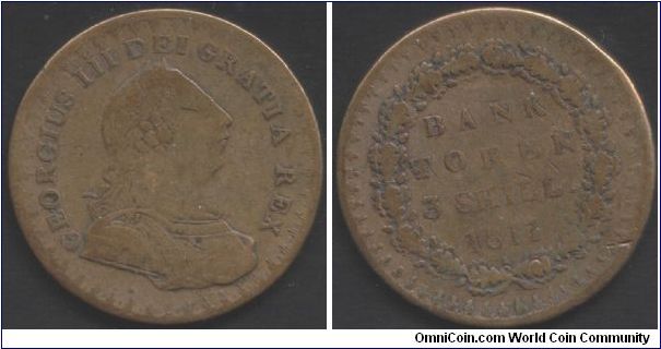 Contemporary counterfeit 3 shillings Bank of England token. The silvering has long since worn off but it would be fairly convincing at one stage in its existence.