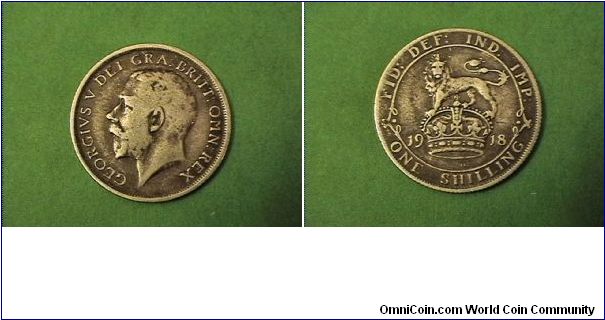 One Shilling silver.

Obv: GEORGE V DEI GRA BRITT OMN REX
Rev: FID DEF IND IMP ONE SHILLING