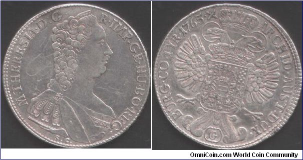 Mature bust of Marie Theresia thaler minted at Gunzburg in Burgau. G in cartouche below eagle. Some graphiti in fields prevents this from being EF.