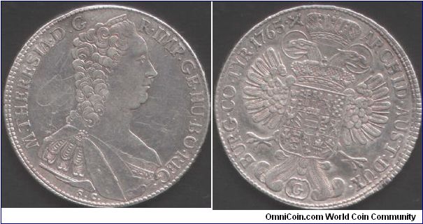 Mature bust of Marie Theresia thaler minted at Gunzburg in Burgau. G in cartouche below eagle. Some graphiti in fields prevents this from being EF.