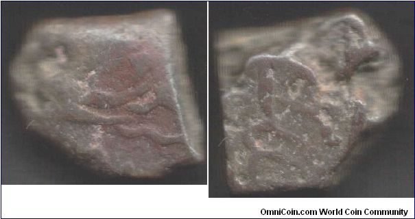 Hyderabad - copper `dub' (paisa). Now this coinage is really crudely made. One thick slug of metal crudely shaped with traces of script on it.
