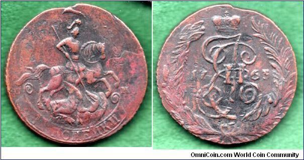 1763 St.Petersburg,Overstruck on 2 kopecks of Elizabeth. These are typicaly overstruck on 4 kopek of 1762, but this one skipped   Peter III!
see old horses tail at new horses nose, and banner above riders head.  Reverse has Elizabeth Monogram upside down on Katherines...