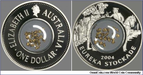 Gold flakes in centre of 2004 Australian silver proof Eureka Stockade dollar.