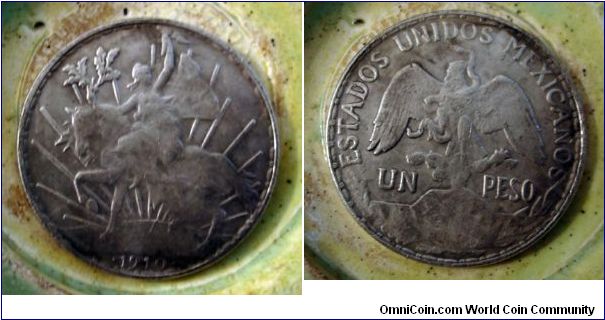 A counterfiet 1910 peso, all have a distinctive die crack right below the horse on the sun.