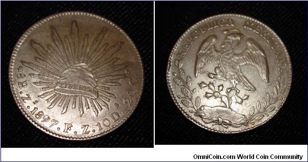 Mexican 8 reale. This coin has some nice lustre left even though it's hard to tell from the photo.