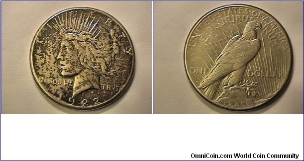 US 1922-S PEACE SILVER DOLLAR. This coin was in a non air tight case which cased the obverse to tarnish but not the reverse. 0.900 silver