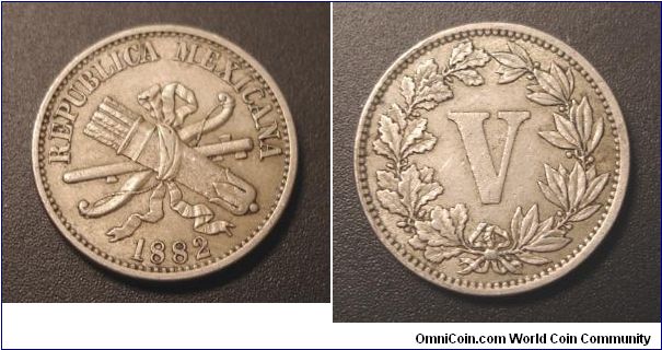 1882 Mexican 5 centavos, or Mexican V nickel.