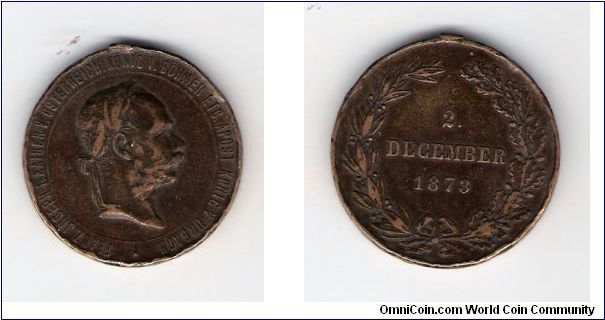 I THINK IT IS A WAR MEDAL WITH FRANZ JOSEPH ON THE OBVERSE
 DECEMBER 2 1873


LINK BELOW
http://www.austro-hungarian-army.co.uk/engage.htm