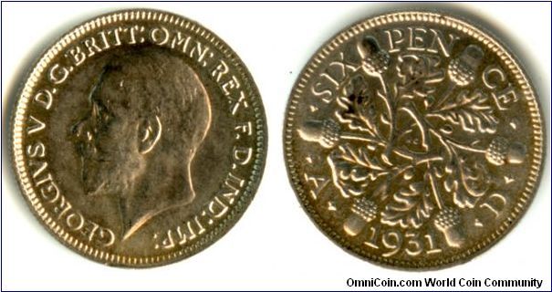 A sixpence coin from 1931. The condition is slightly better than what the picture is showing, specifically the hair on the portrait. I need to learn how to photograph silver coins.