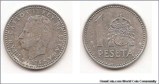 1 Peseta
KM#821
1.2000 g., Aluminum, 21 mm. Ruler: Juan Carlos I Obv: Head left
Rev: Crowned shield flanked by pillars with banner to right of value