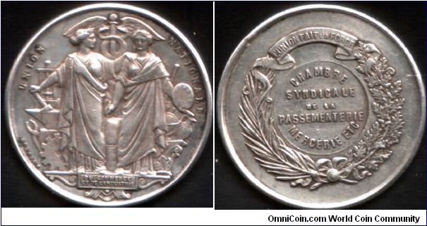 silver jeton for the  Braid Makers and Haberdashers syndicate / union. Echos of the old Troisieme Corps (one of the six main merchant guilds of Paris). This jeton undated, but issued after 1880.