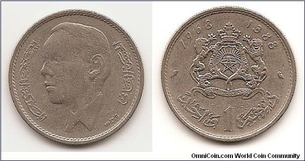 1 Dirham
Y#56
Nickel, 23.6 mm. Obv: Head left Rev: Crowned arms with
supporters
