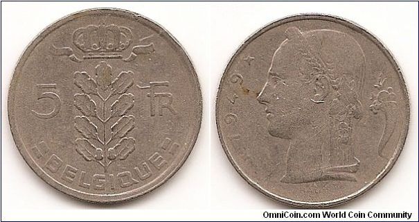 5 Francs
KM#134.1
6.0000 g., Copper-Nickel, 24 mm. Obv: Plant divides
denomination, Crown at top, legend in French Obv. Leg.:
BELGIQUE Rev: Laureate head, left, small diamonds flank date
at left, symbol at right Edge: Reeded
