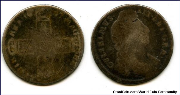 1696/7
1/- Shilling
Cruciform shilds with Dutch lion in center
William III 1694-1702
No ribbon at nape of neck! 
possibly Bristol or Chester