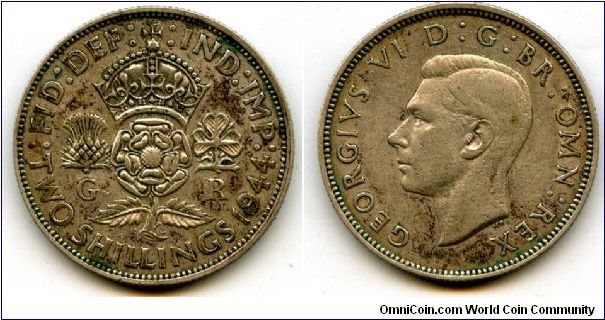 1944
2/-  Two Shillings
Crowned Rose, flanked by a Thistle & a Shamrock
King George VI