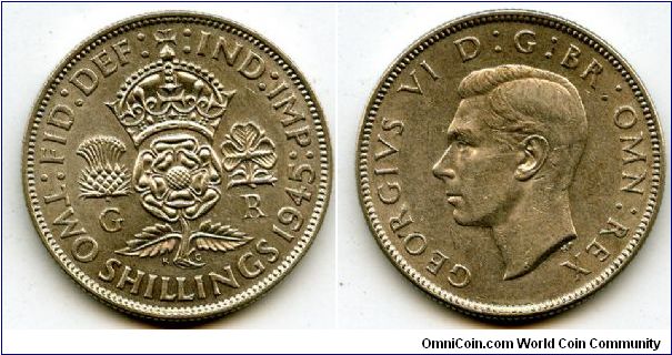 1945
2/-  Two Shillings
Crowned Rose, flanked by a Thistle & a Shamrock
King George VI