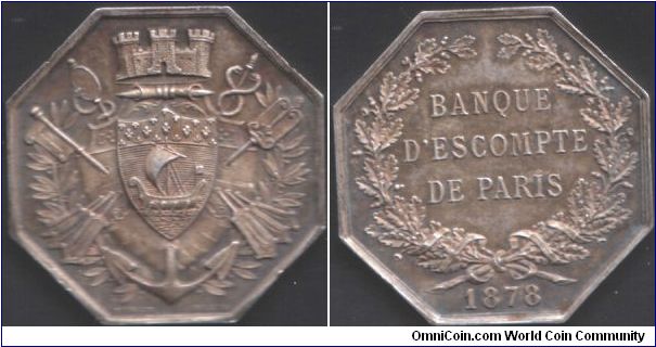 Silver `jeton de presence' issued for the Banque D'Escompte de Paris in 1878. Very three dimensional and unusually hefty (3mm thick)for a jeton. Engraver : Stern.