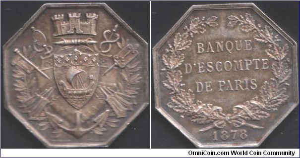 Silver `jeton de presence' issued for the Banque D'Escompte de Paris in 1878. Very three dimensional and unusually hefty (3mm thick)for a jeton. Engraver : Stern.