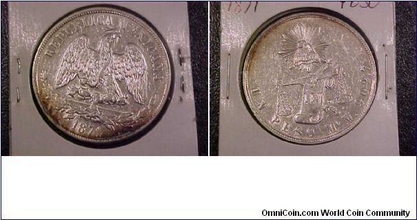 1871 Mo peso, looks to have been cleaned but starting to retone.