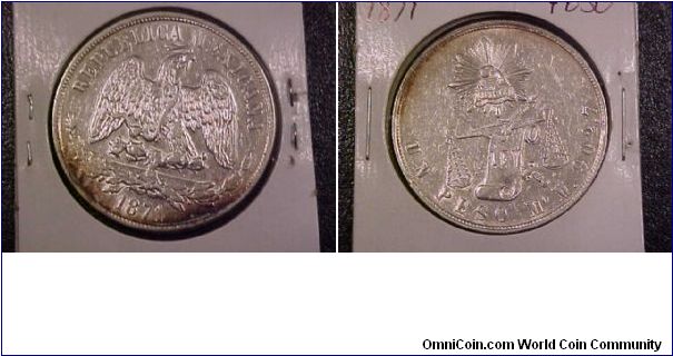 1871 Mo peso, looks to have been cleaned but starting to retone.