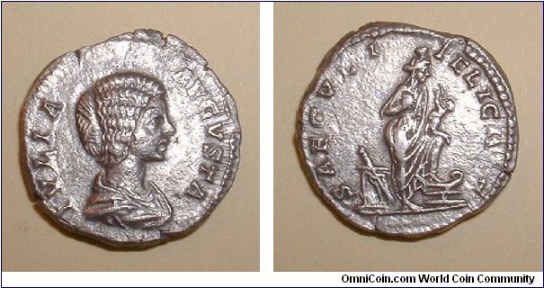 JULIA DOMNA - Denarius - IVLIA AVGVSTA, draped bust right / SAECVLI FELICITAS, Isis, wearing polos on head, standing right, left foot on prow, holding Horus; behind, rudder resting against altar. Mm. 17,9 grs 3,4